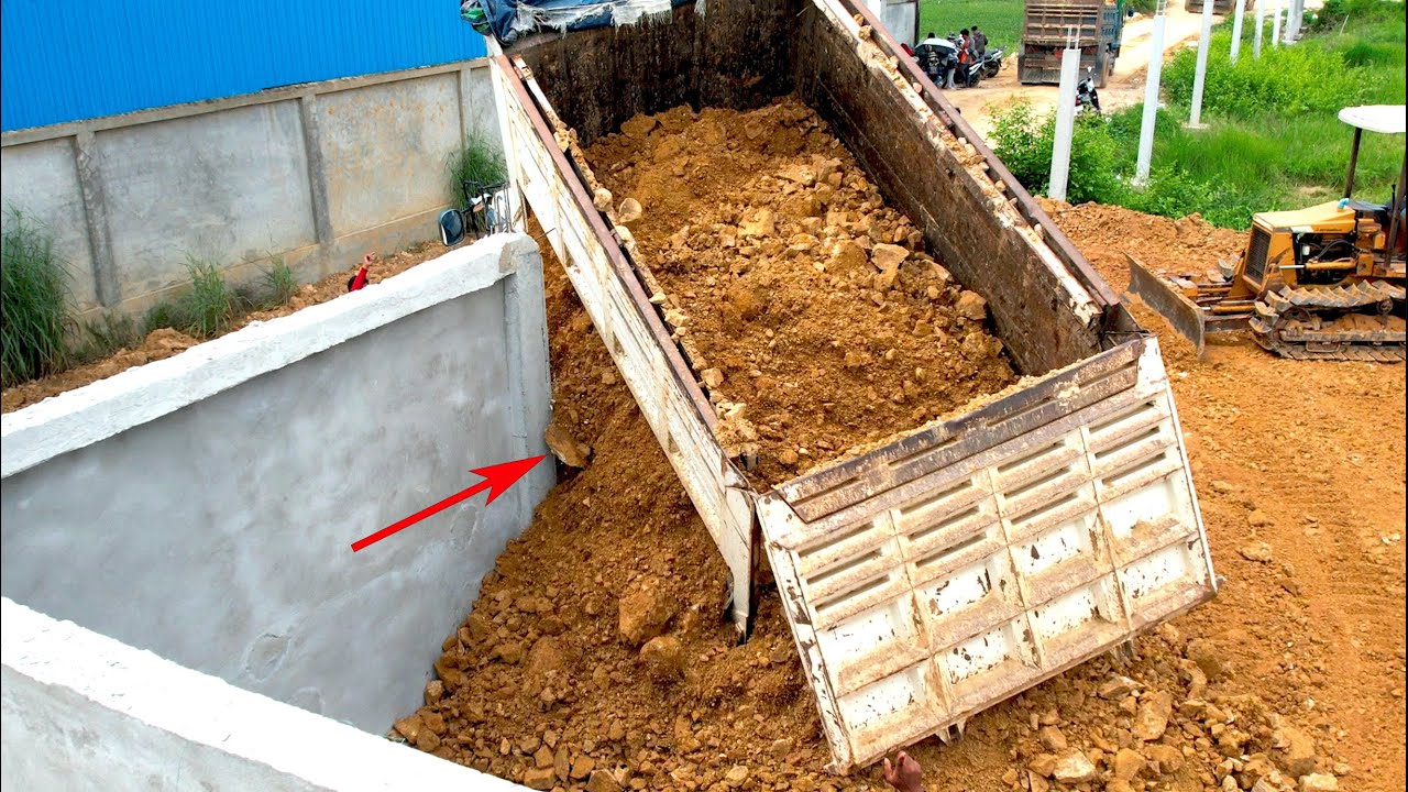 Incredible Process NISSAN Dump Truck Is Tilted Unloading Near The Fence & Bulldozer Push Soil
