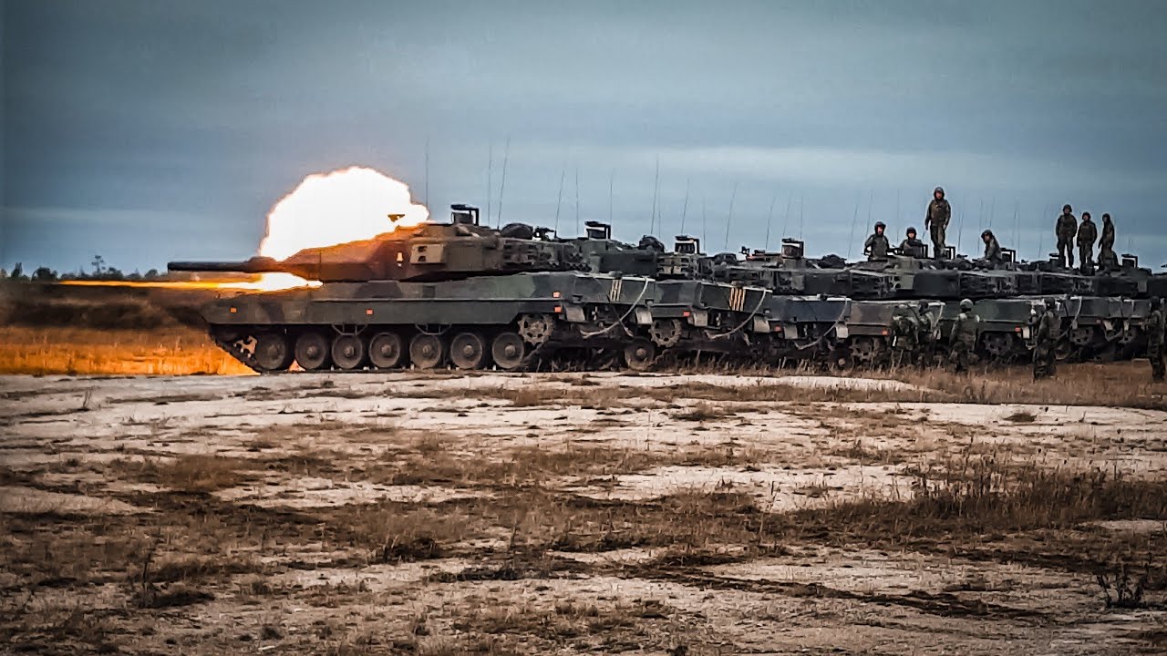 Leopard 2 tank (Stridsvagn 122) firing main gun