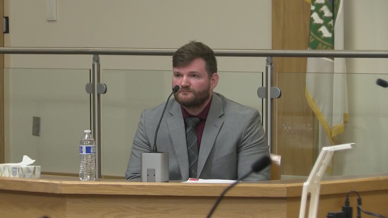Former APD officer accused of dragging disabled man out of Target takes the stand