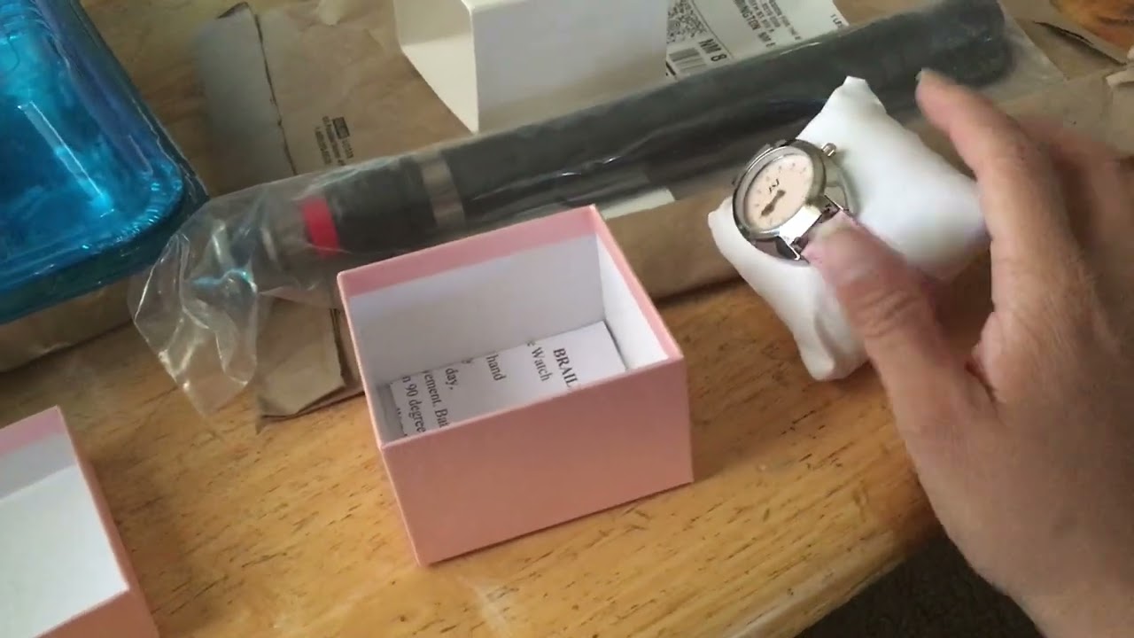 Unboxing my new telescopic cane and my Braille watch…