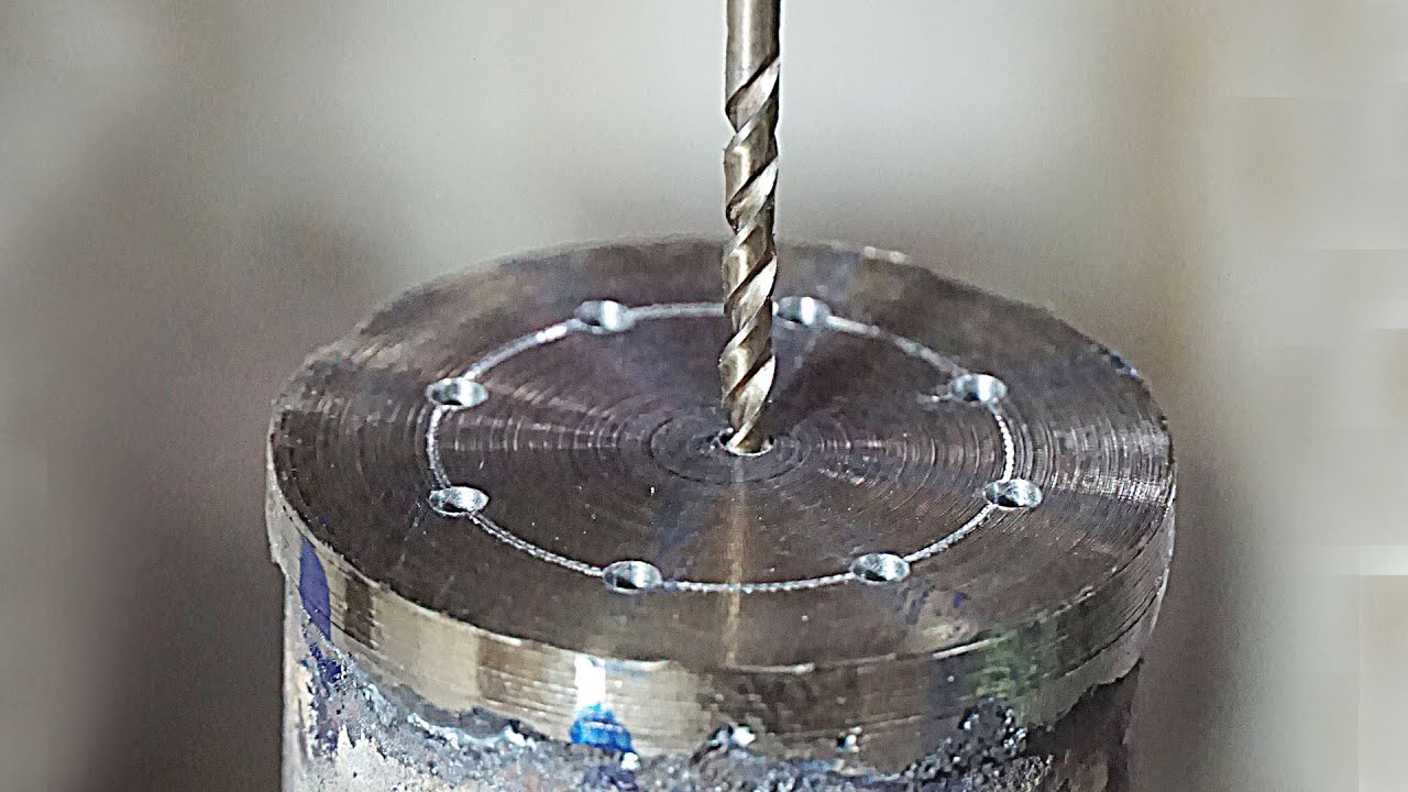 A waste oil burner with forced draft and drip feed. Review.