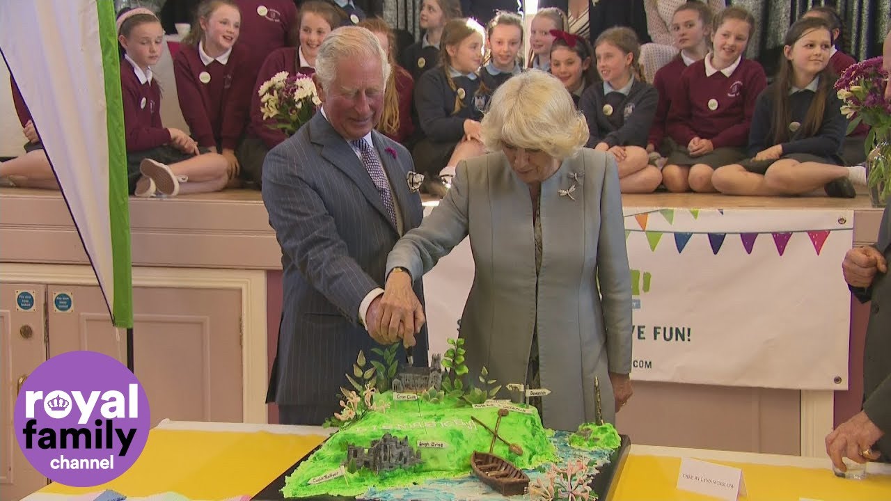 Prince Charles and the Duchess of Cornwall cut cake at community event in Northern Ireland