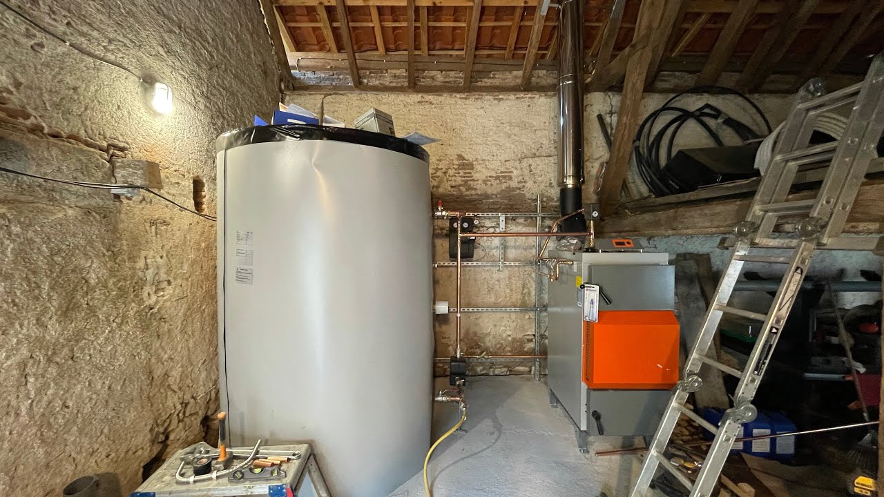 The installation of a wood gasification boiler and solar collector heating system for the Mill