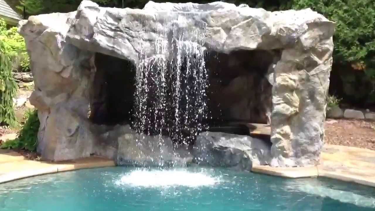 A cool grotto with a hottub   We also did the stamped concrete