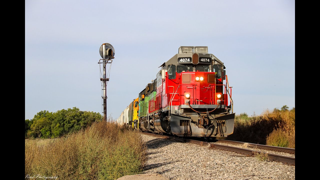 CORP 4074 Tunnel Motor leading KYLLISA 10 across the old Rock Island mainline in Kansas