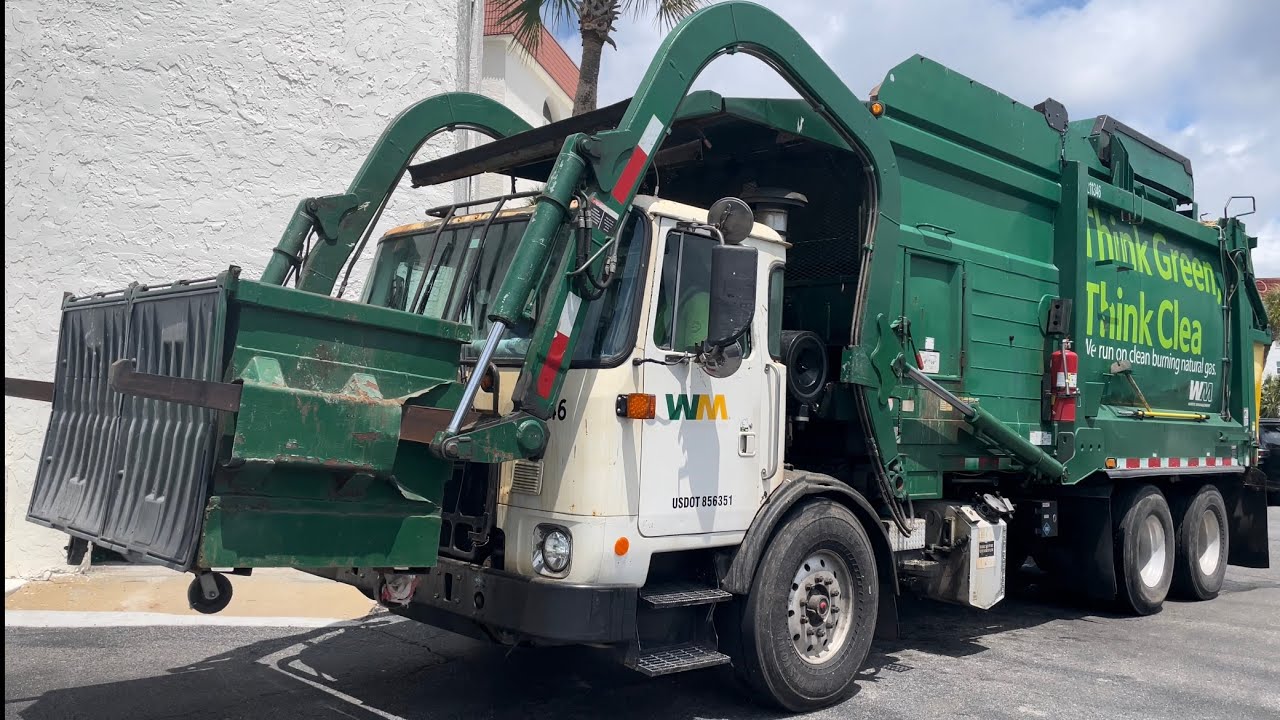 Waste Management Autocar ACX Heil Half/Pack Front Loader Garbage Truck on Beach House Trash