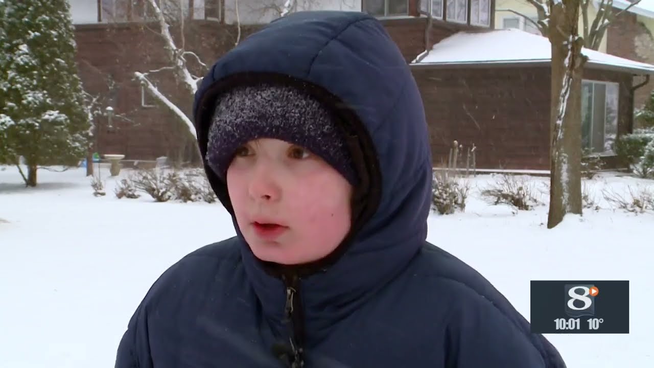 Local resident reacts to the snow and cold in the area today