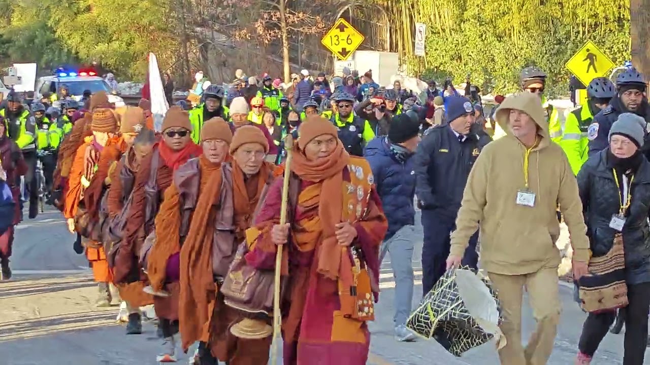 The Buddist Monks  walk for peace coming up Arizona Ave entering DC