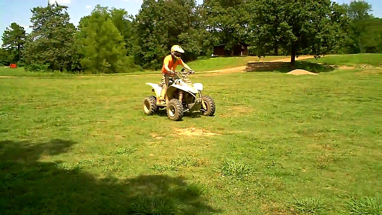 Wheelies on modified 2006 Polaris Trailblazer 250. (Wolf Pen Gap Mena, AR )