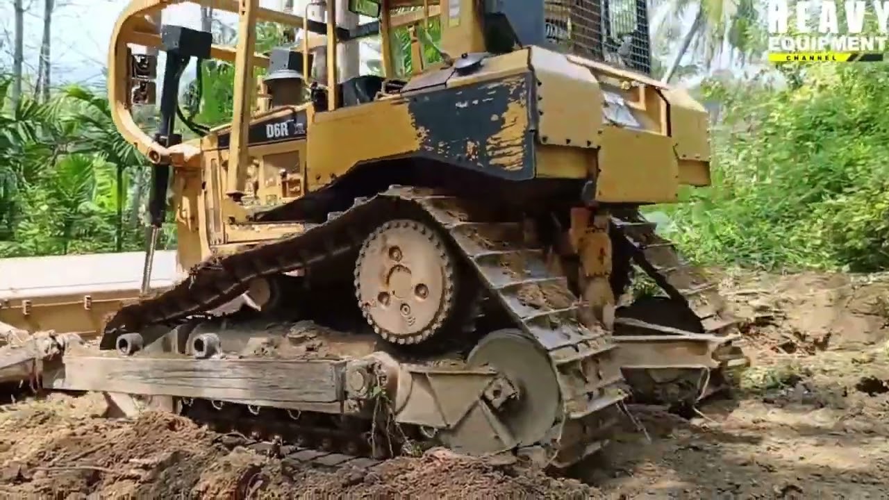 Highly Experienced Caterpillar D6R XL Bulldozer Operators Work to Smooth Plantation Roads