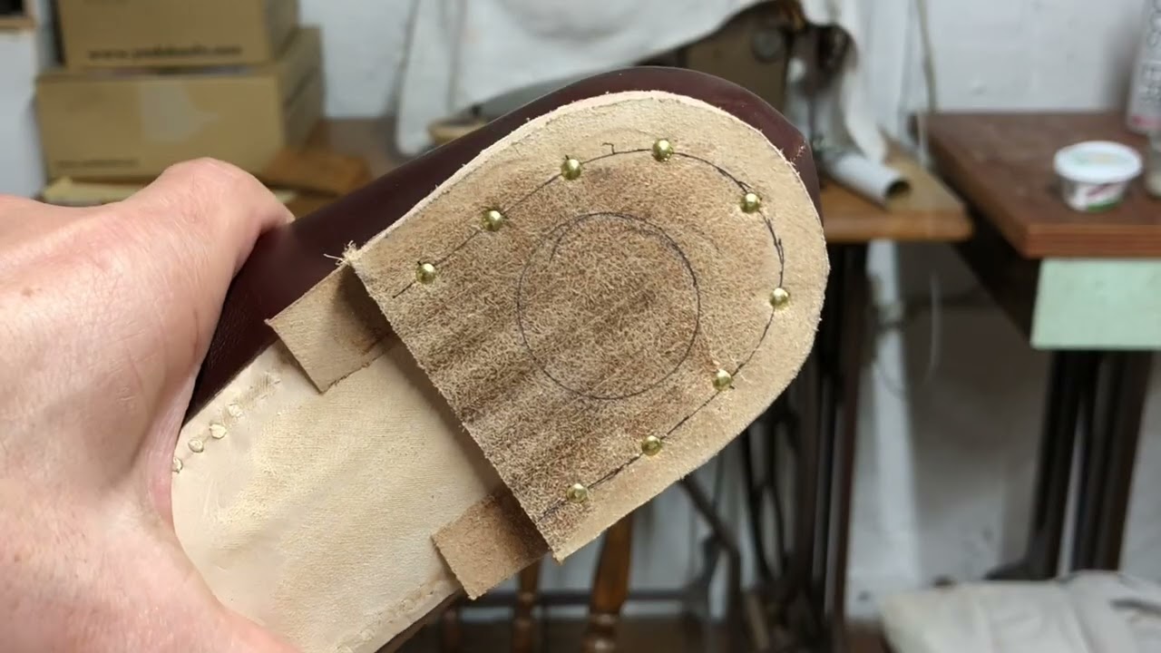 Shoes making with Norwegian construction . Attach the heel, Tool to check flat of the heel.