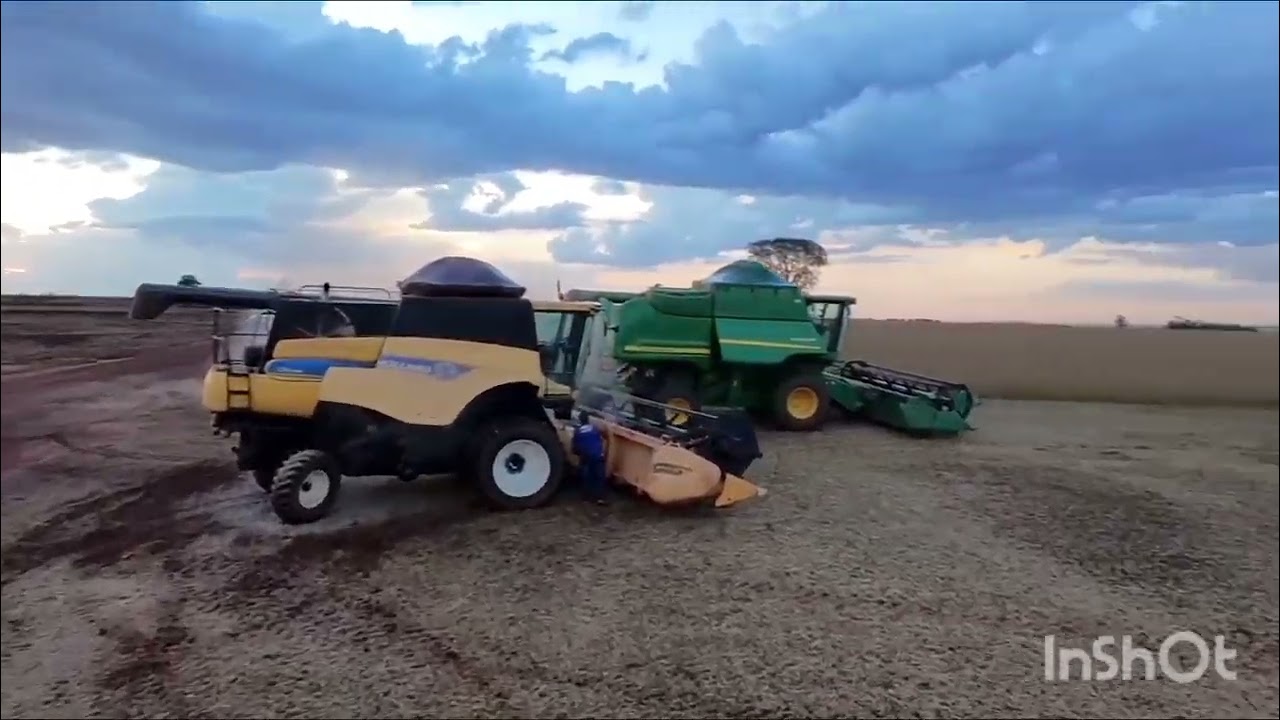 Drone. Tratores plantando milho, colhetadeira colhendo soja, chuva. 🚜🌧️