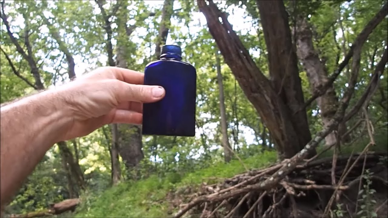 Metal Detecting In The River Collecting Bottles