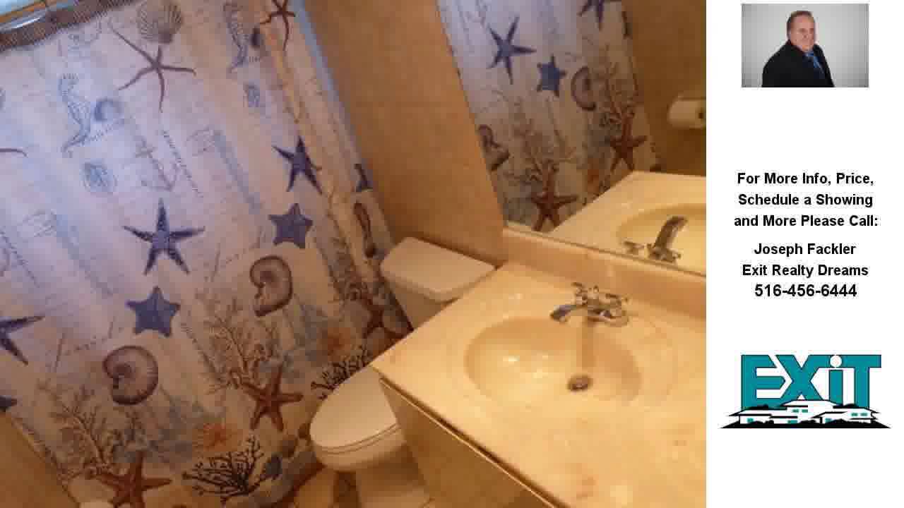 28 Brewster Road West, Massapequa, NY Presented by Joseph Fackler.