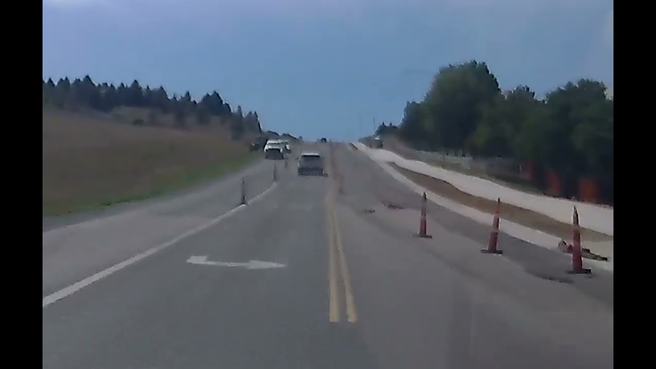 Distracted driver hits traffic cone