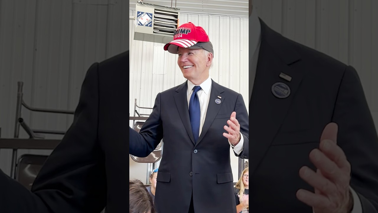 Joe Biden wears Trump hat and tells crowd not to eat dogs and cats