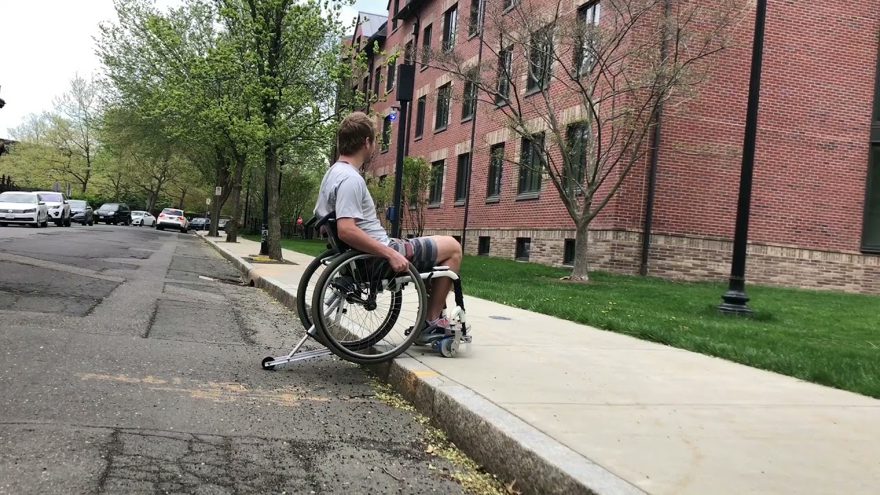 Wheelchair Add-On Device to Climb a Single Step
