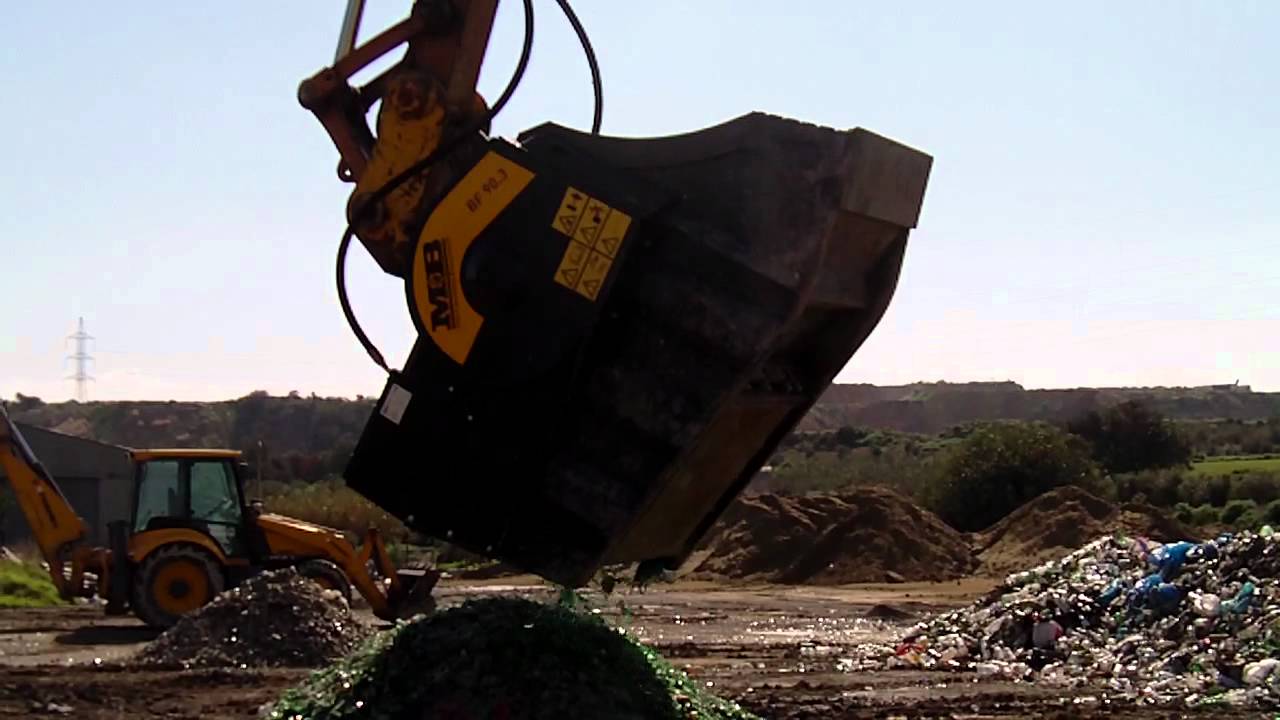MB crusher bucket crushing bottles of glasses - www.mbcrusher.com