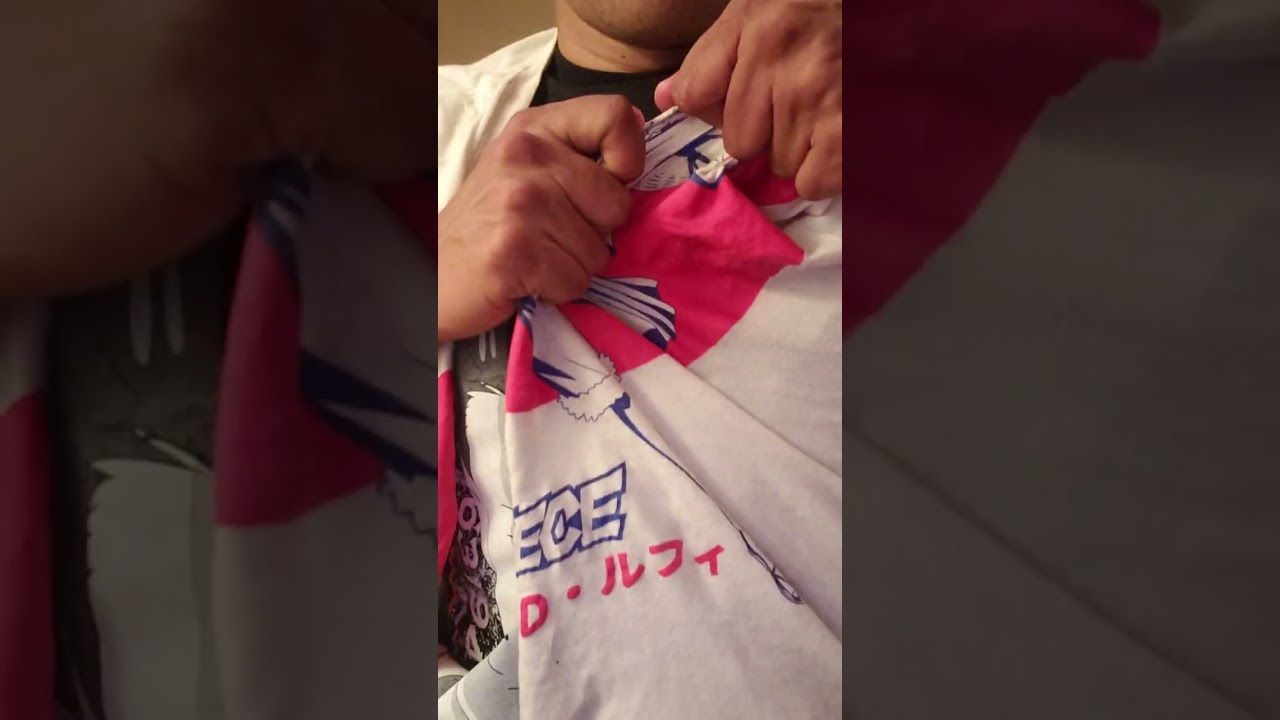 Ripping up One Piece Luffy anime shirt