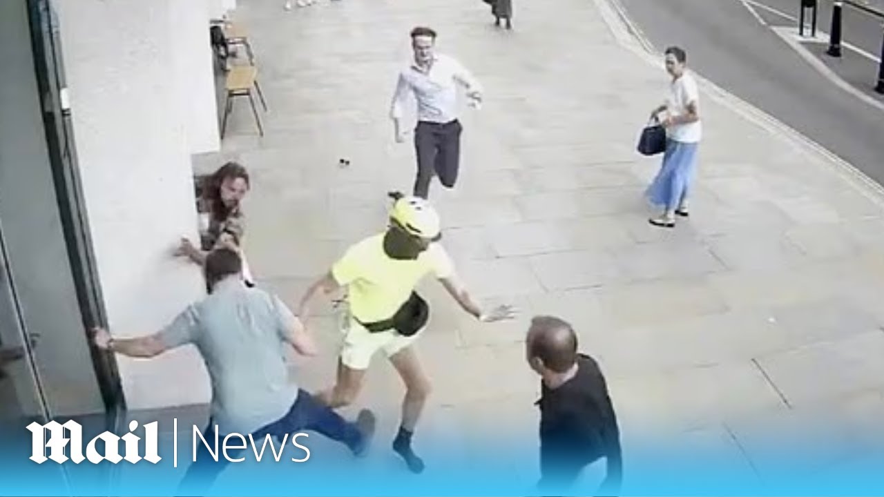 Moment phone snatcher receives instant karma as he's knocked off his bike by furious Londoners