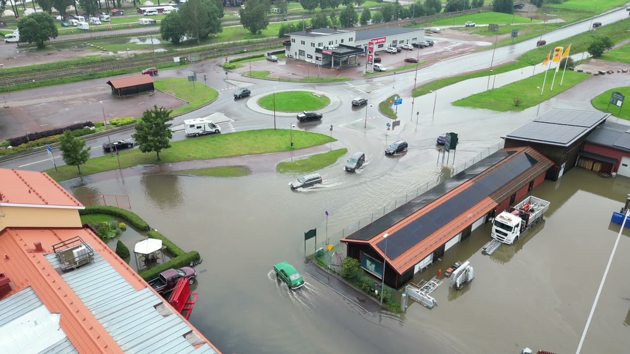 Flooded Streets and Traffic in R&auml;ttvik, Dalarna &ndash; Aerial Drone View