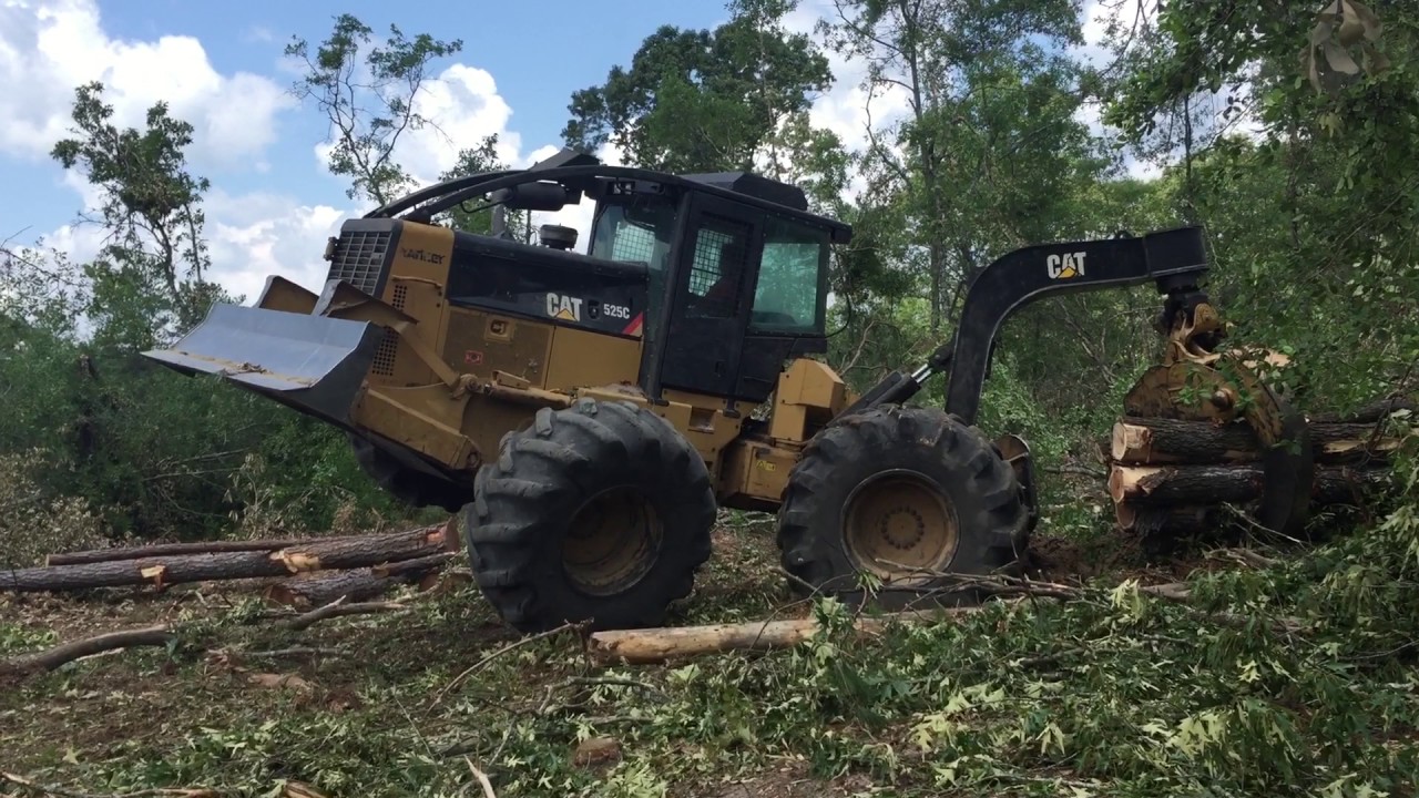 Cat 525 log skidder wheelie