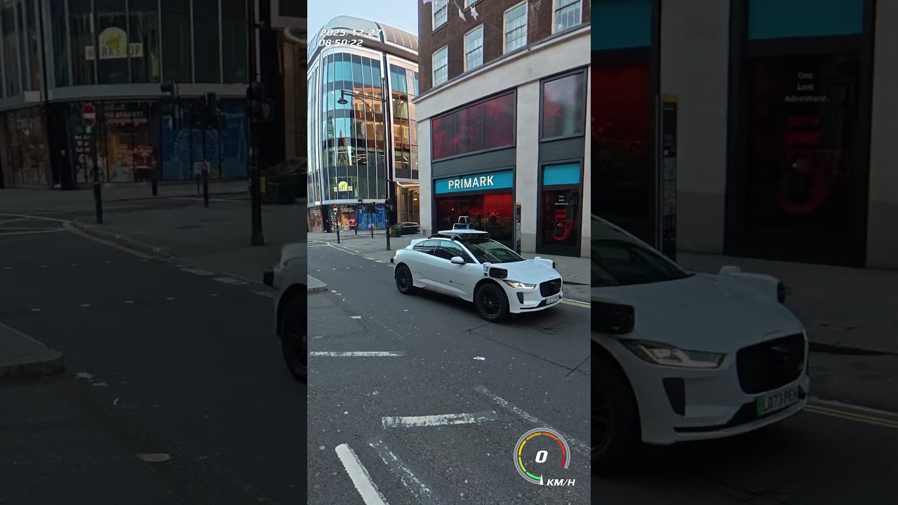 WAYMO Self driving car in London on Oxford Street. Driver in the driver seat. Prepping for FSD?