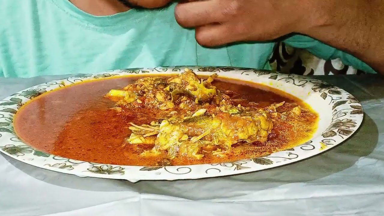 Eating fish curry 