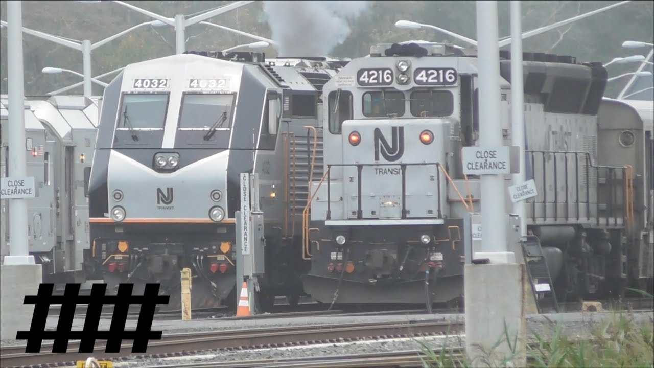 New Jersey Transit Trains at Sea Ave Railroad Crossing on the North Jersey Coast Line in NJ