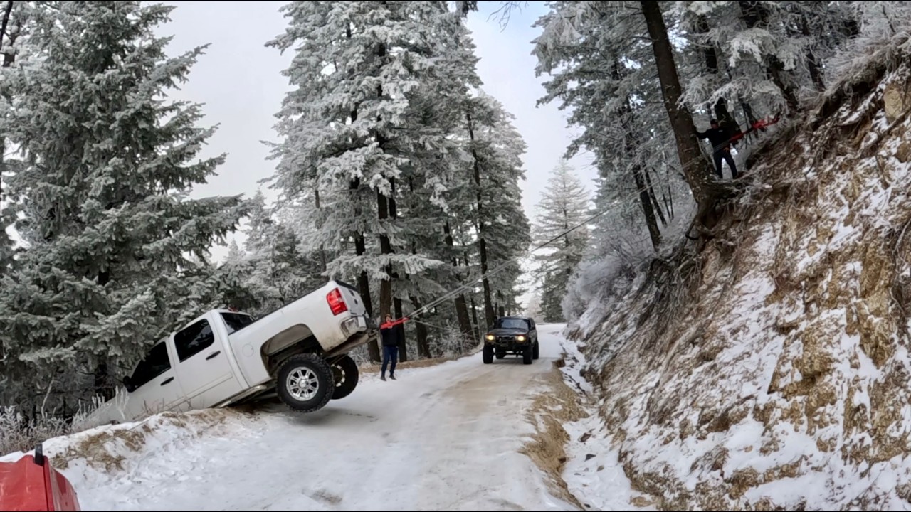 Silverado slides off an icy cliff