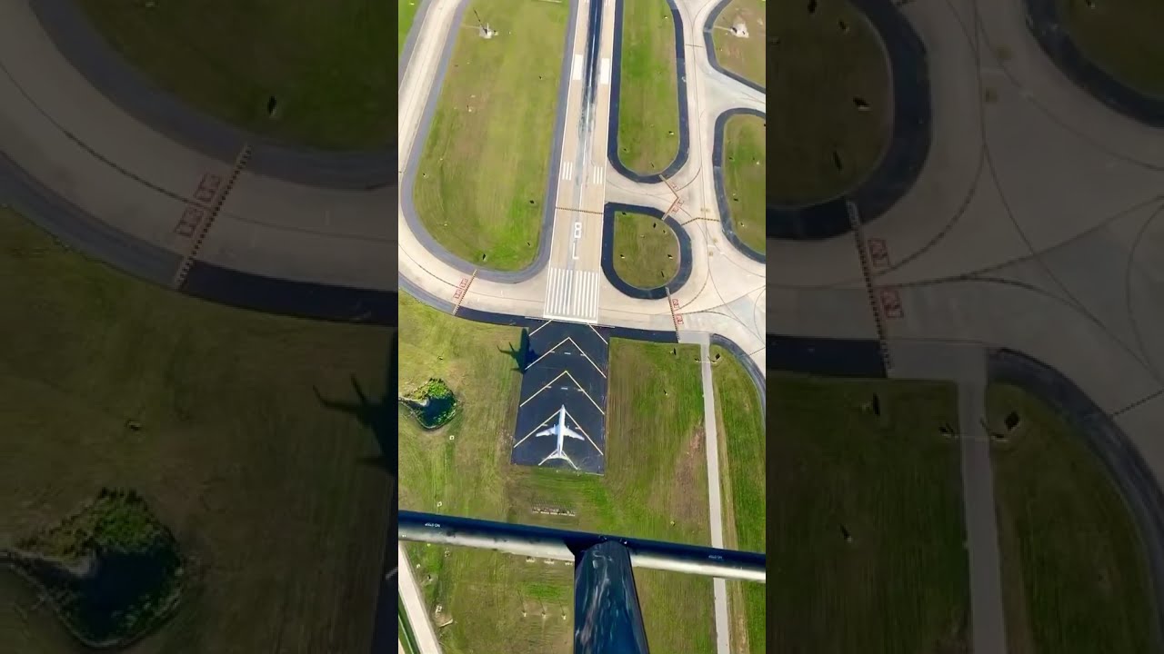 Flying Over A Landing Plane