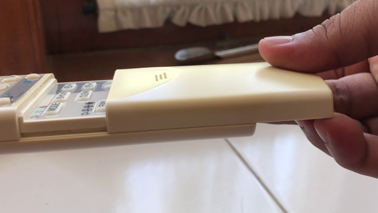 cara mengganti baterai remote AC sharp