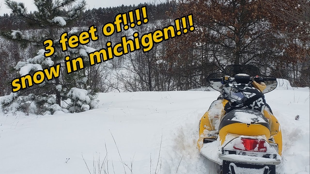 3 feet of snow in Michigan Prudenville!! on the power lines skidoo600 sdi mbrp and greasy triple 600