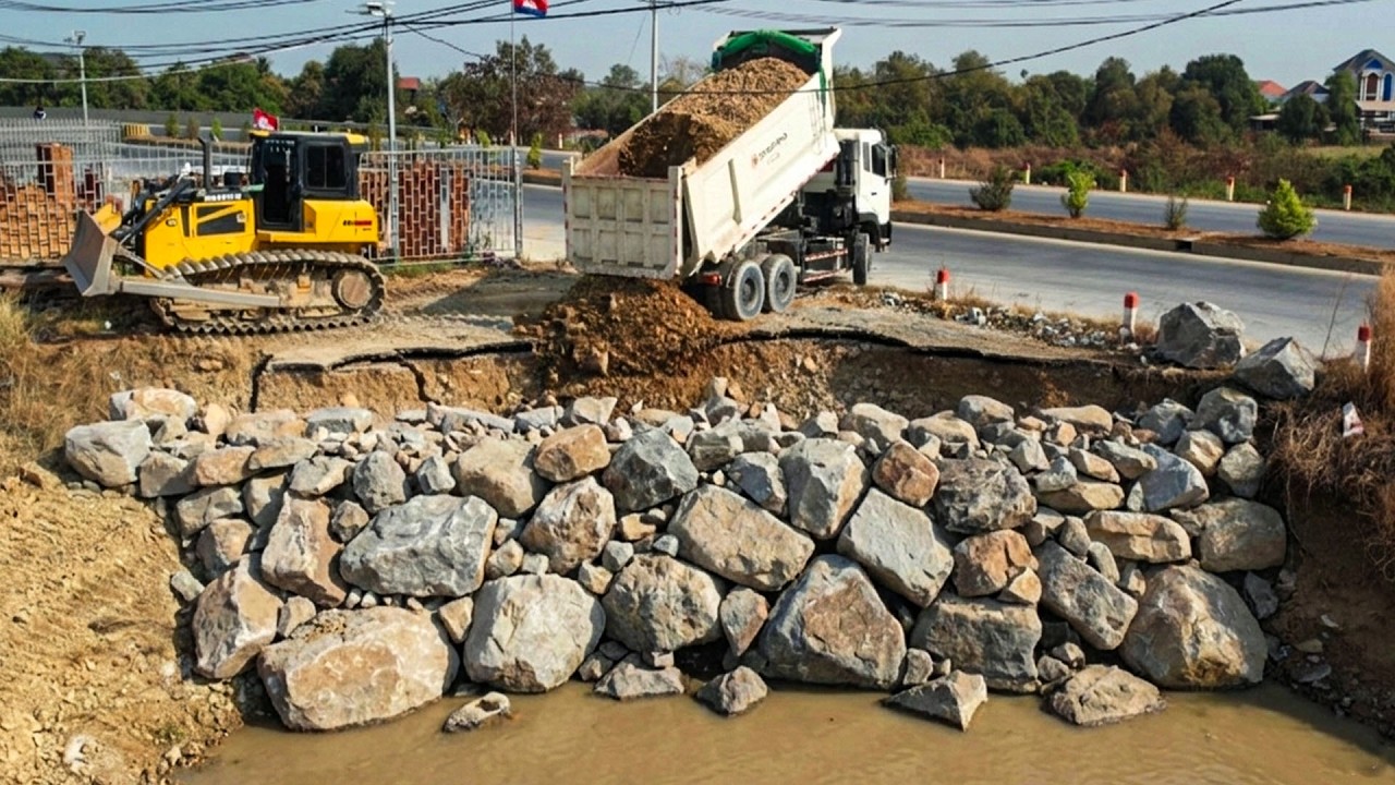 New project next to highway filled with Dozers SHANTUI & Truck 25.5T Dongfang Throw a stone
