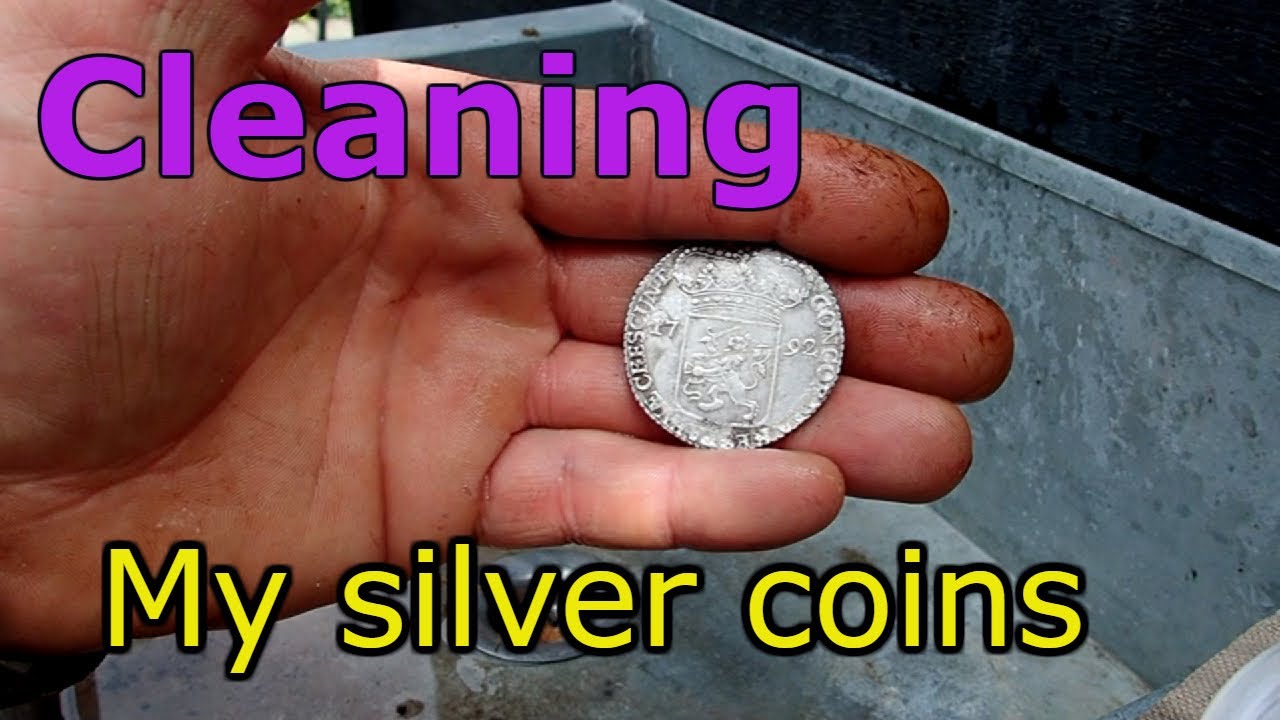 Cleaning old silver coins found while metal detecting.