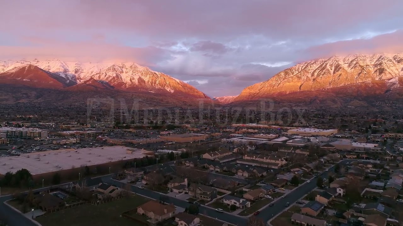 Stock Video - Aerial view of department stores during the holidays at sunset