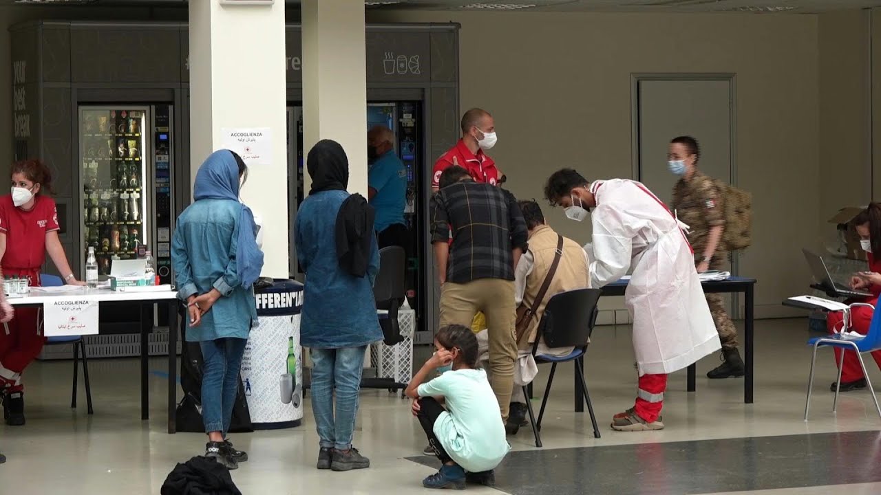 Italian diplomats, Afghans arrive in Rome from Kabul | AFP
