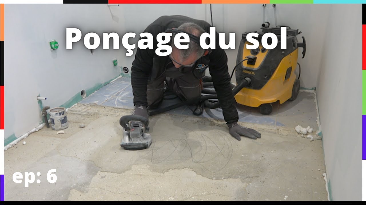 Ponçage du sol en béton avant le ragréage.