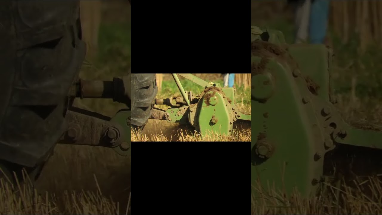 Precision in Motion: Close-Up of Tractor Rotary Cultivator in Action