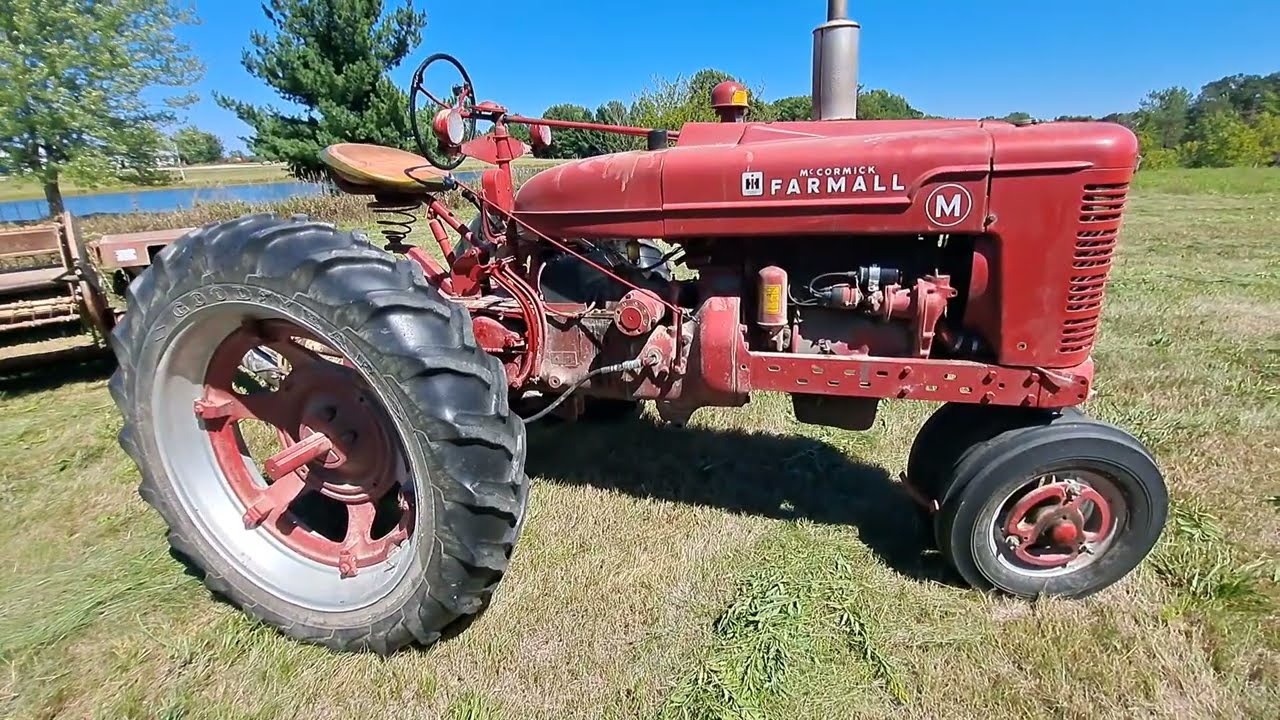 Farmall M Mowing with a New Idea 290 Haybine
