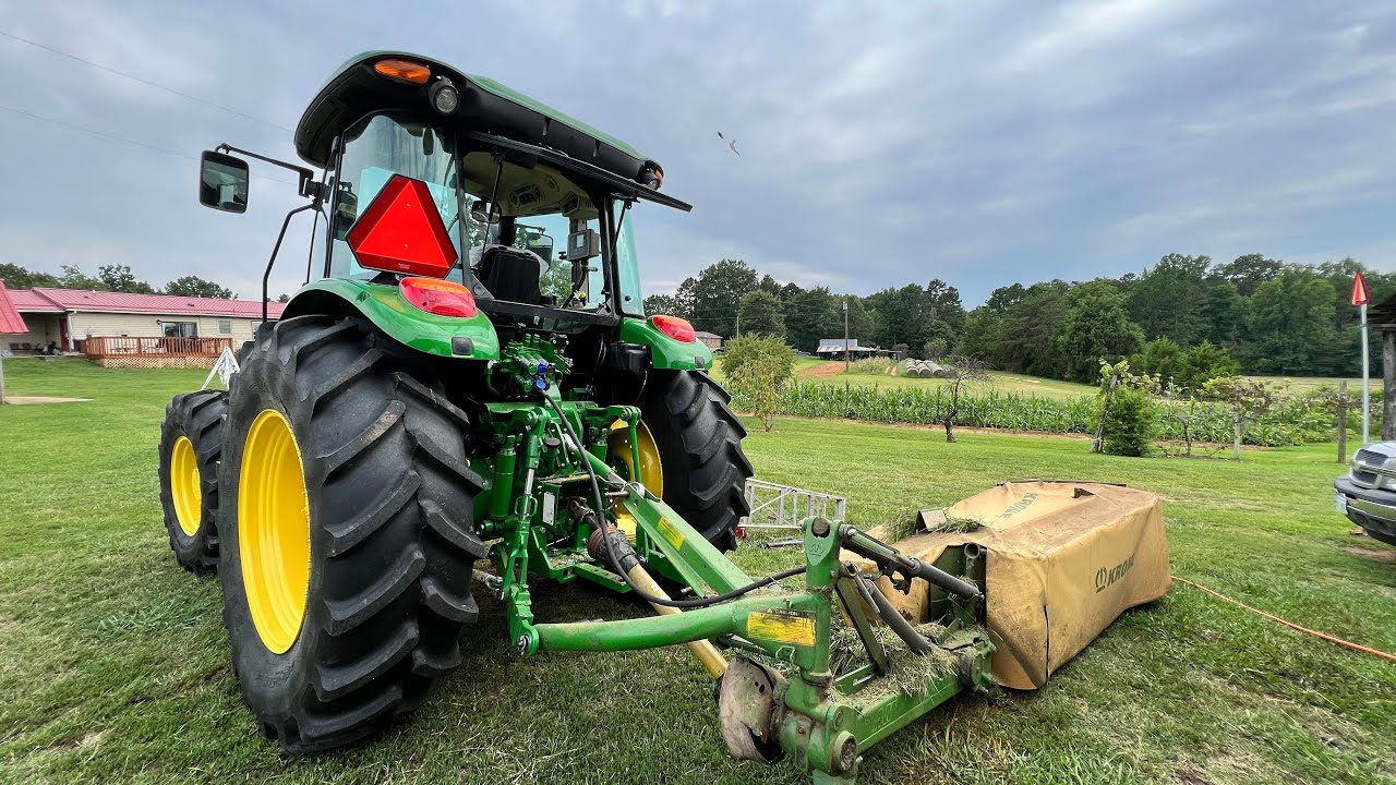 Brand New John Deere 5M Cutting Hay.