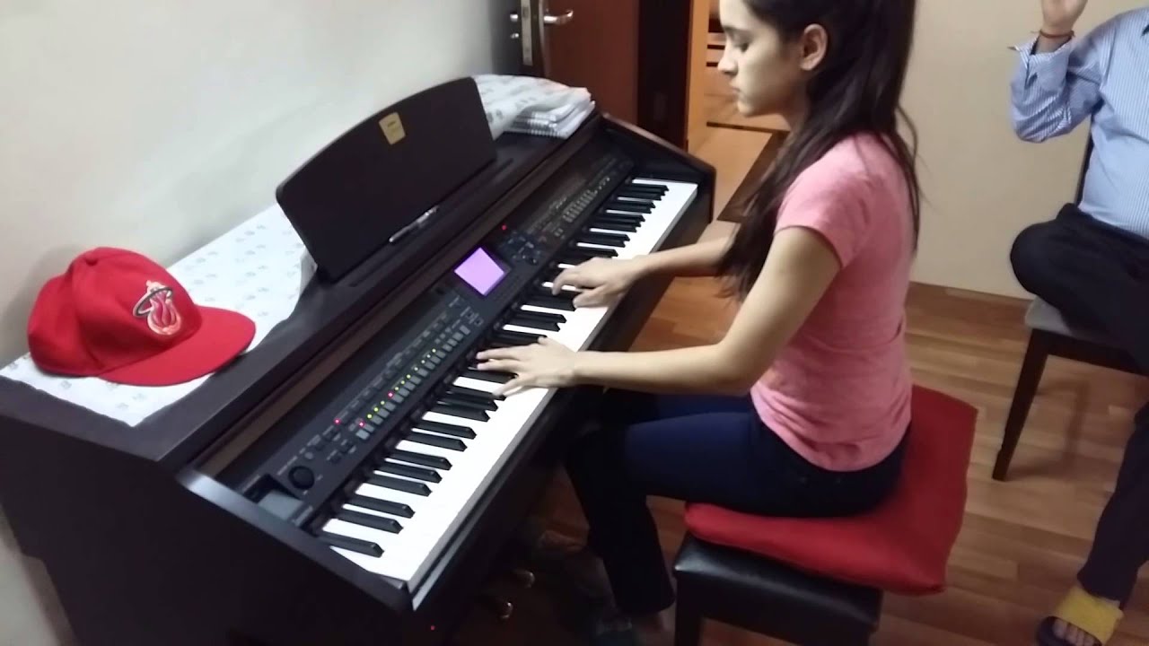 Tina on grand piano playing hindi composition