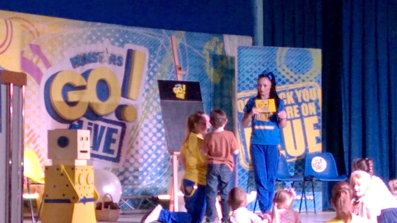 liam on stage playing a game in the funstars go live show at reighton sands