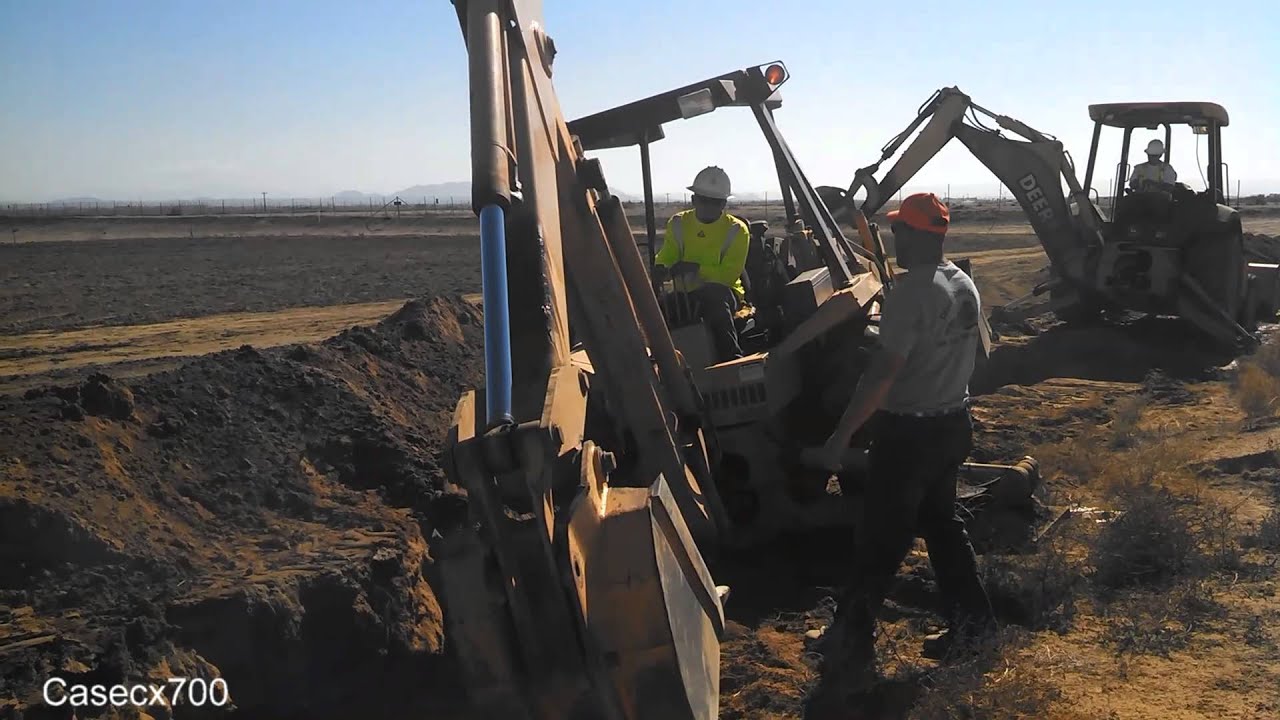 CASE 580E Backhoe Jumping a Trench