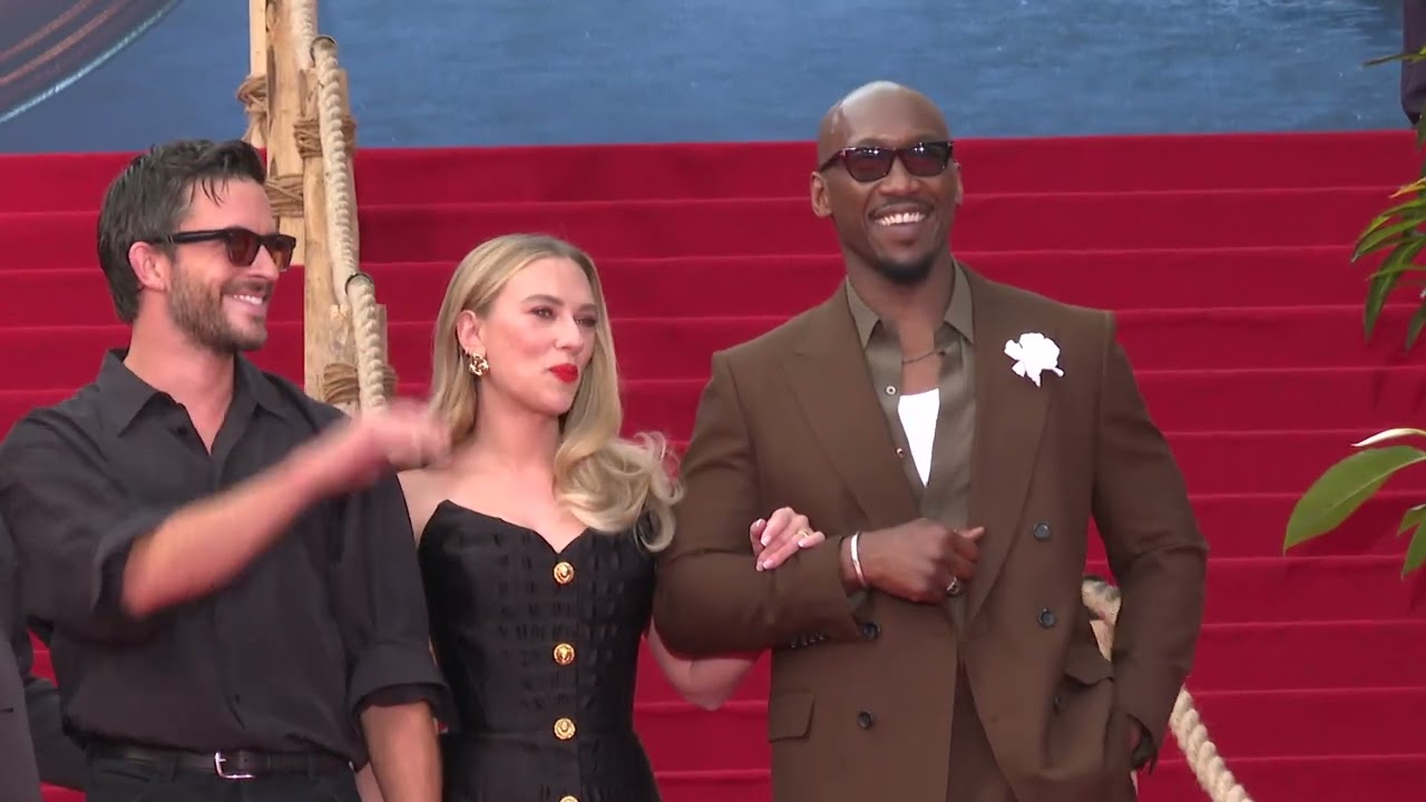 Scarlett Johansson holding hands with Jonathan Baily at Berlin Premiere of JURASSIC WORLD - REBIRTH