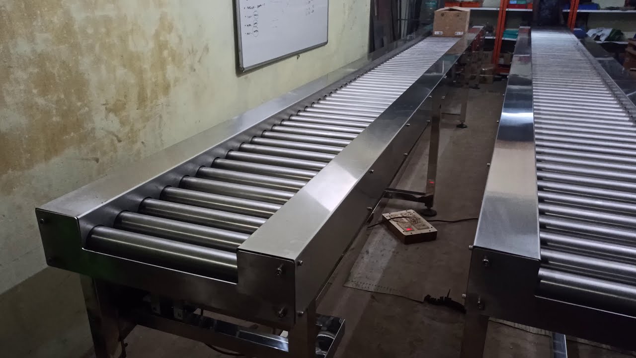 Orange Conveyor Systems - SS Power and Free Roller Conveyor