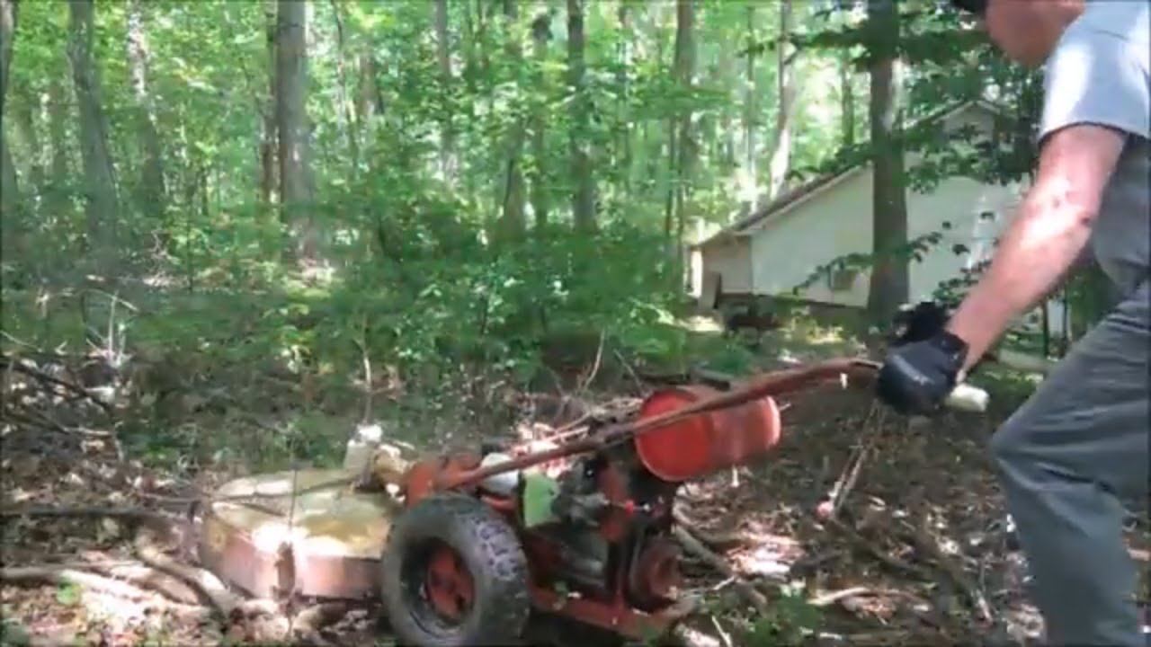 Gravely Two Wheel Tractor Destroying Brush.