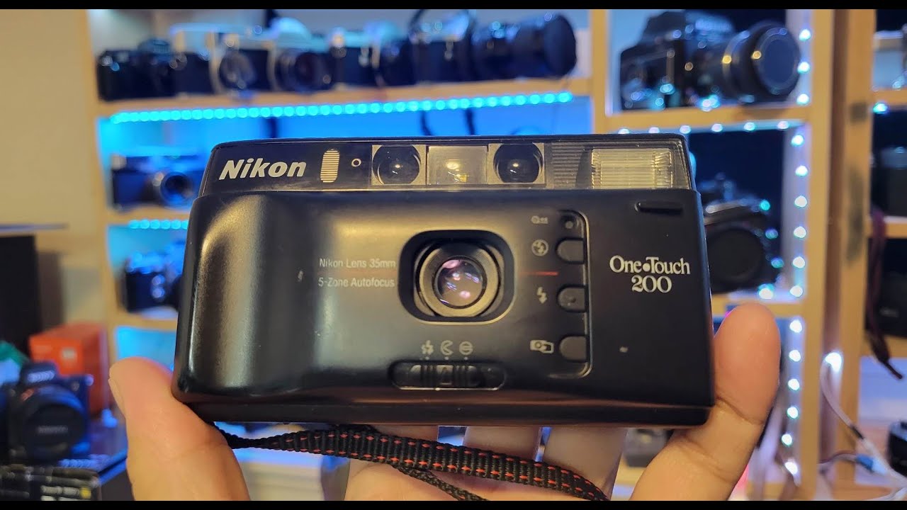 Nikon one touch 200 ( Nikon W35)* Quick look * Battery loading * Film loading