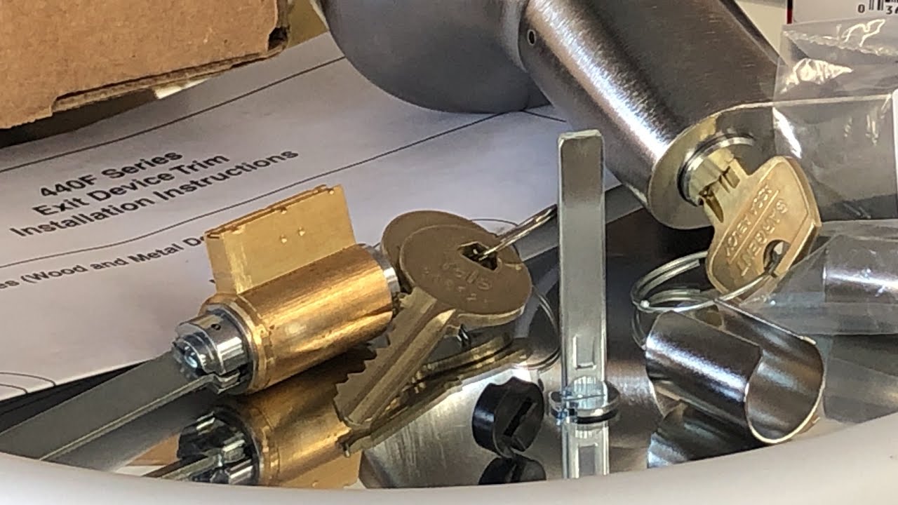 the part needed to replace the key cylinder in a Yale exit device trim