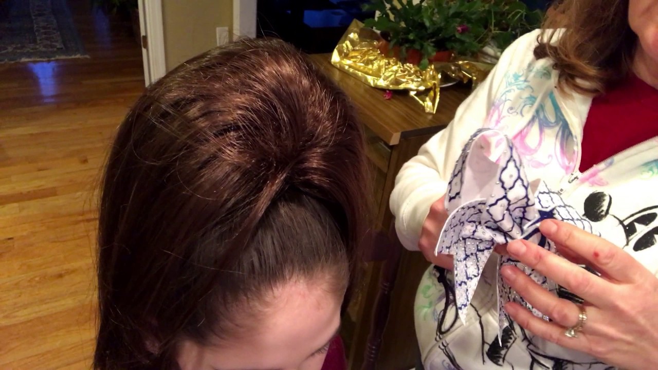 How to put on a cheer bow with a hair piece on